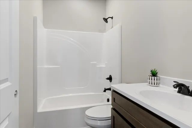 a kitchen with kitchen island a sink and stove