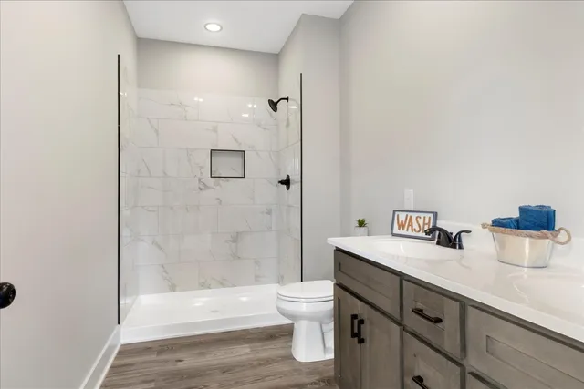 a bathroom with a sink vanity and a mirror
