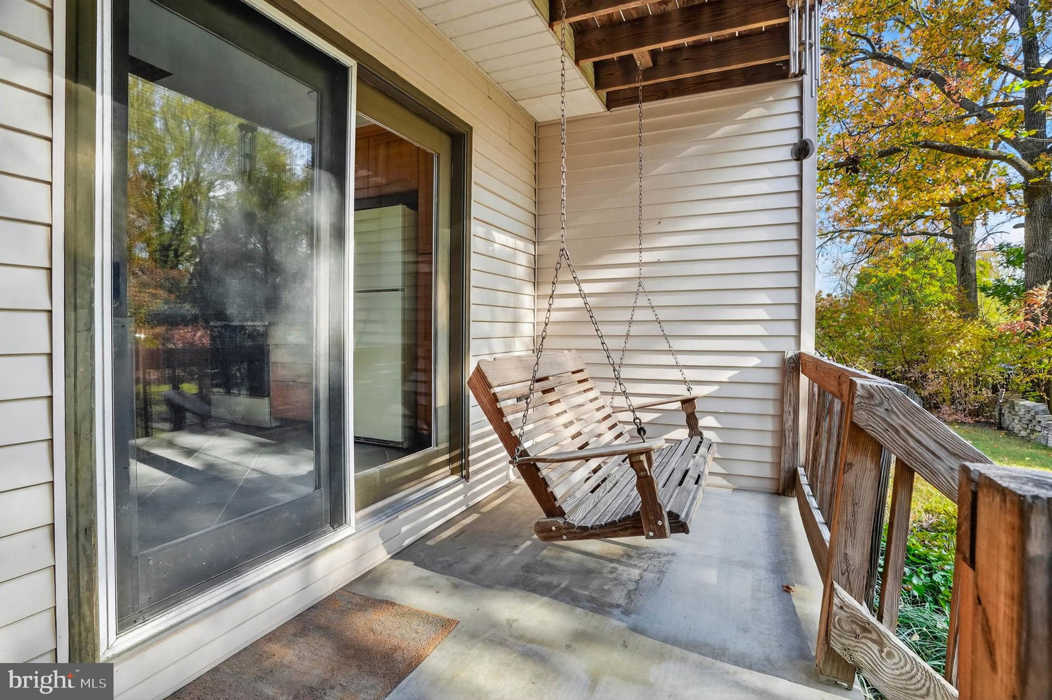 8203 Willow Street Laurel, MD 20707 - Photo 17 of 41 a view of balcony with two chairs and wooden floor