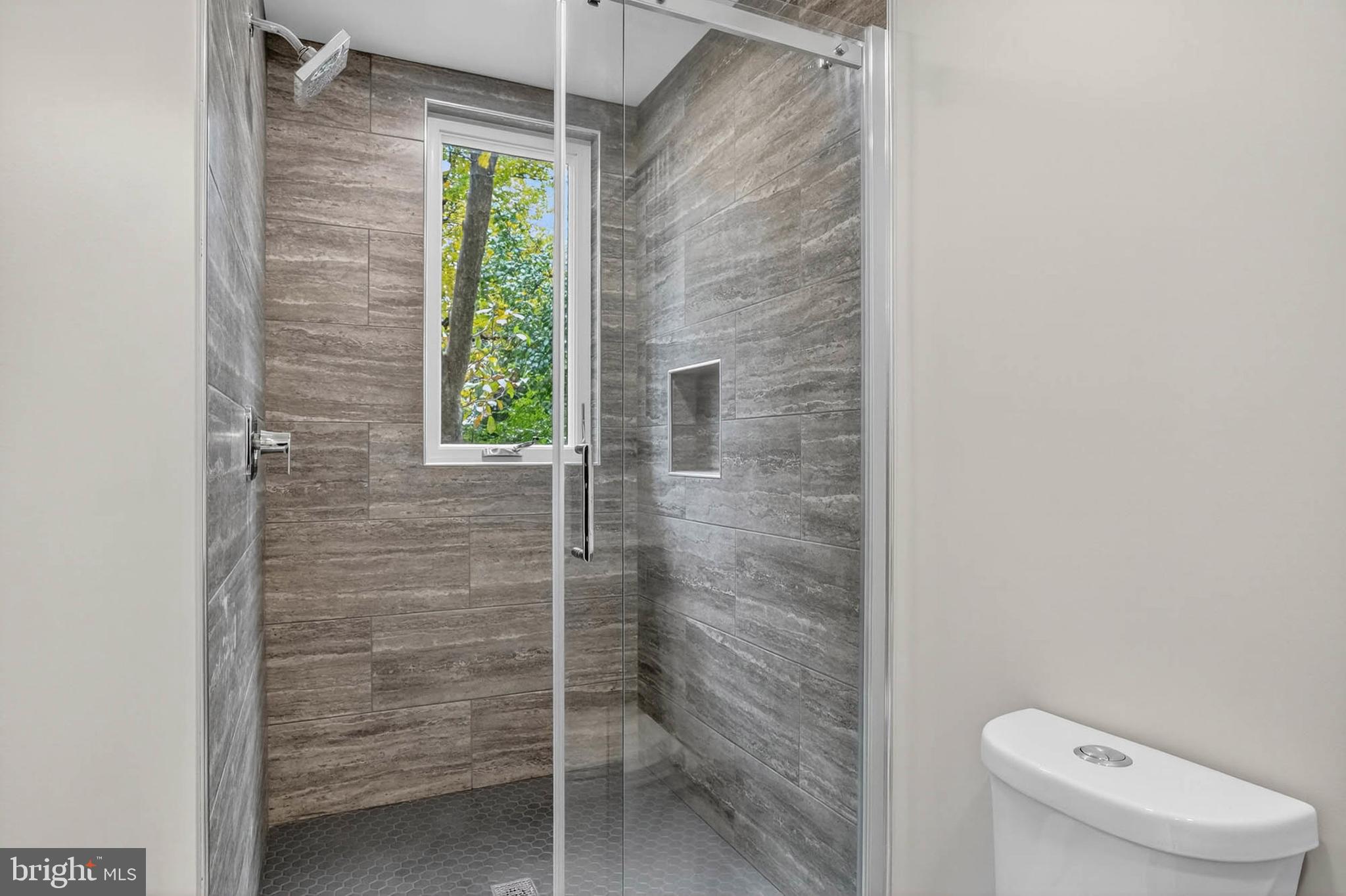 8203 Willow Street Laurel, MD 20707 - Photo 20 of 41 a bathroom with a toilet