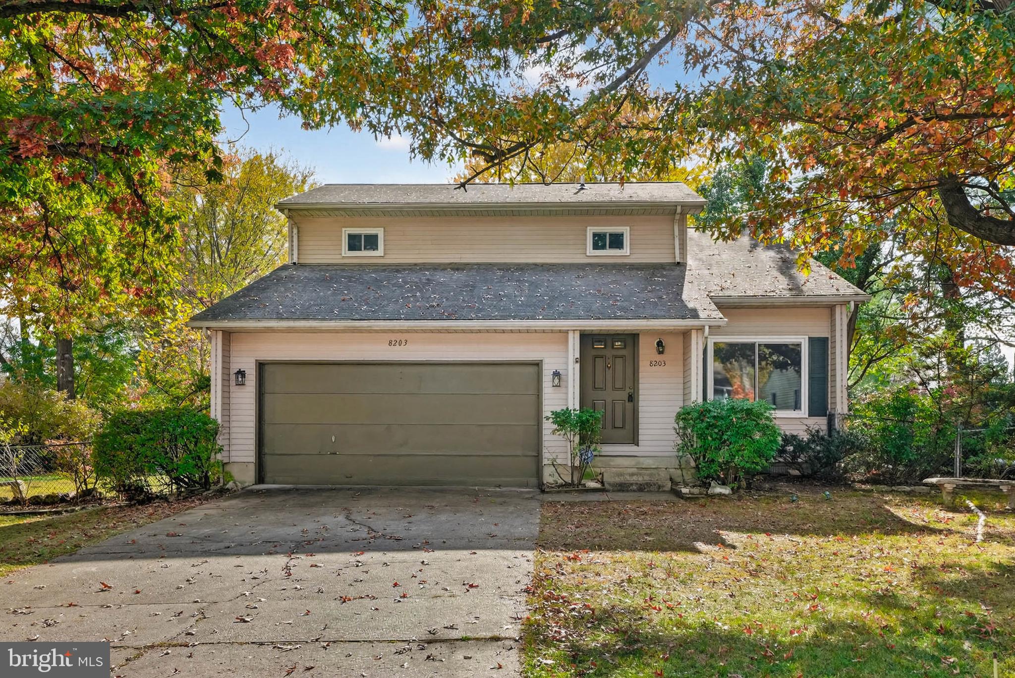 8203 Willow Street Laurel, MD 20707 - Photo 2 of 41 a front view of a house with a yard and garage