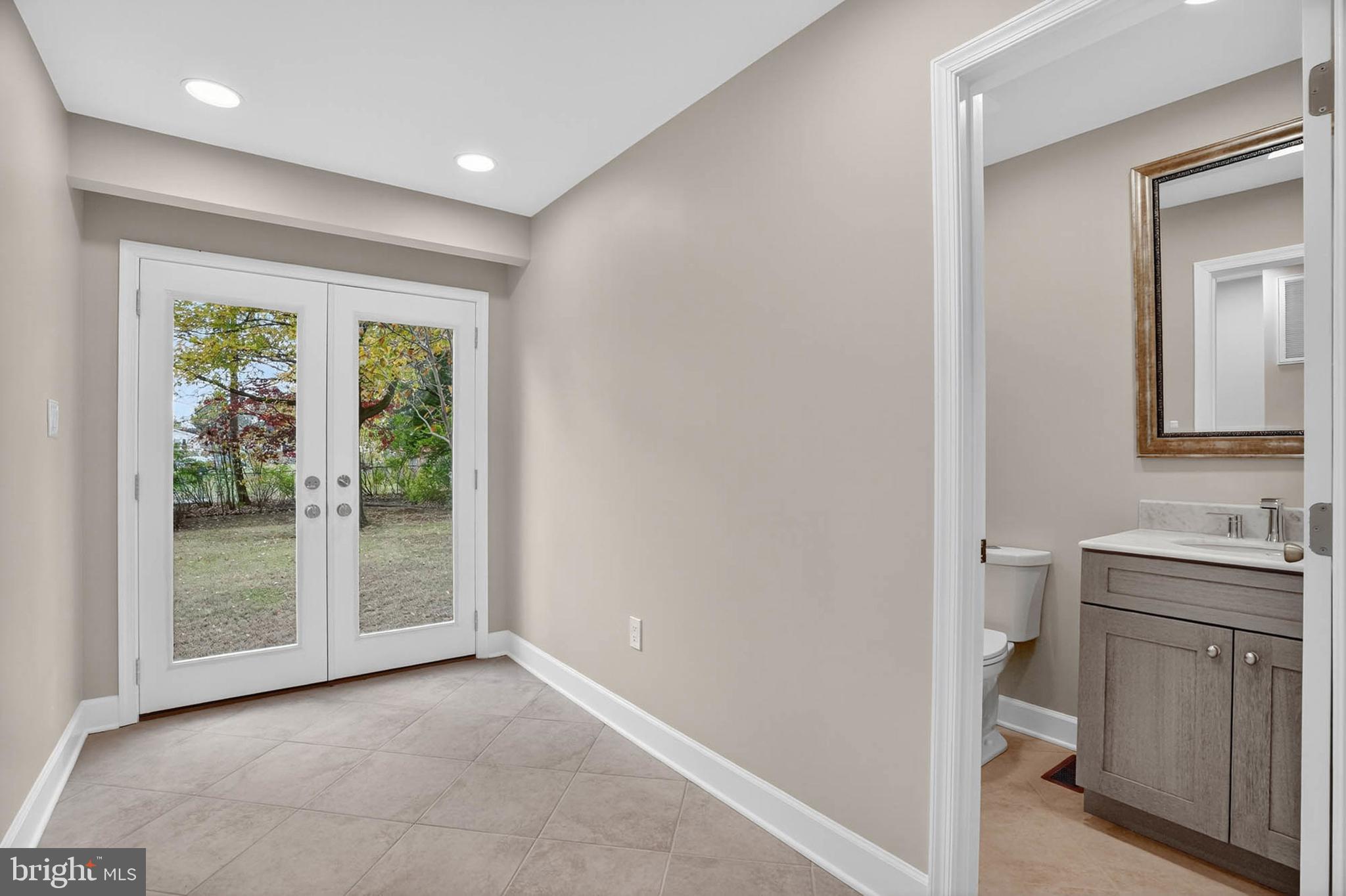 8203 Willow Street Laurel, MD 20707 - Photo 21 of 41 a view of a kitchen from the hallway