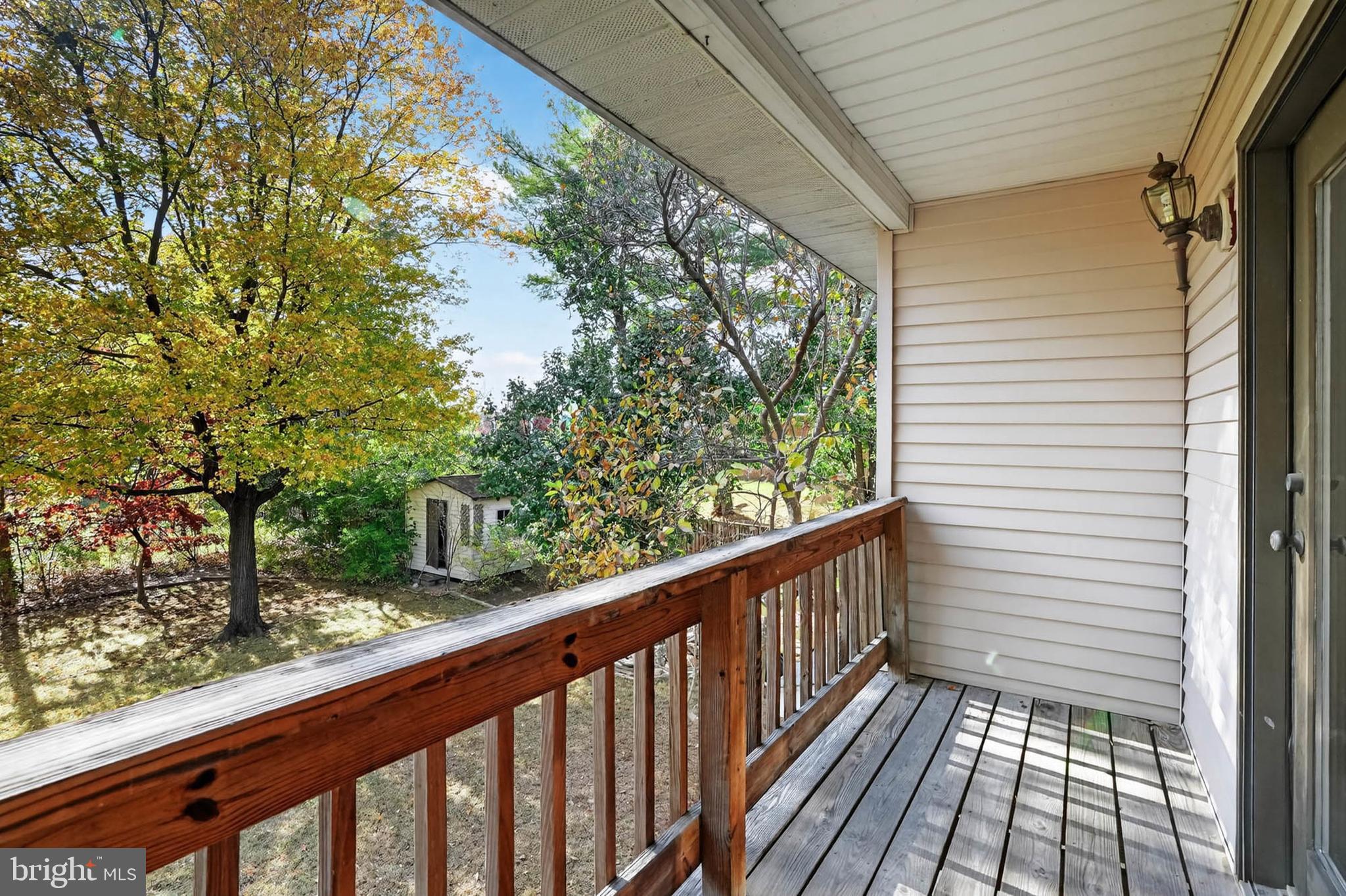 8203 Willow Street Laurel, MD 20707 - Photo 26 of 41 a view of balcony with wooden floor