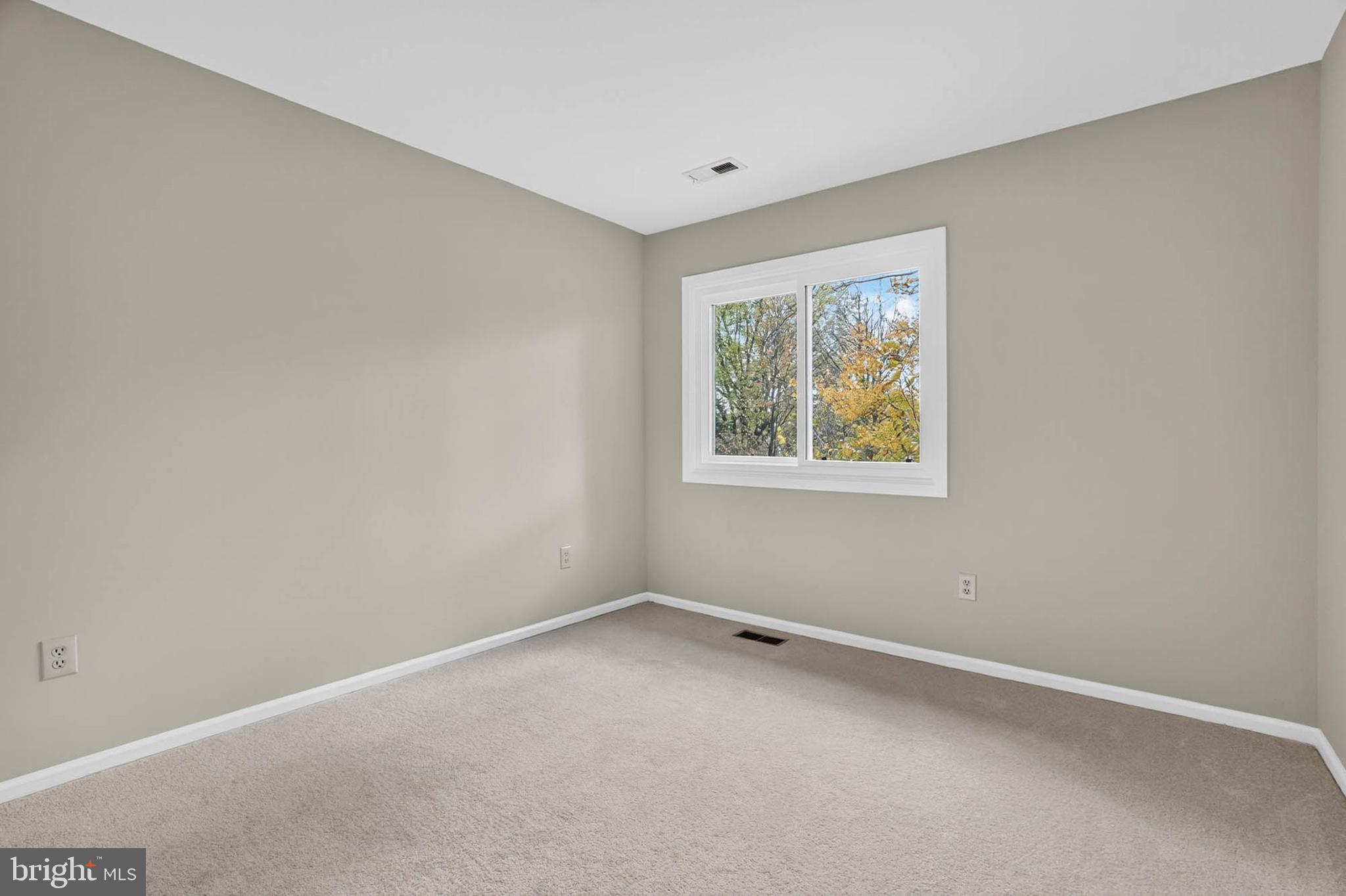 8203 Willow Street Laurel, MD 20707 - Photo 32 of 41 an empty room with windows
