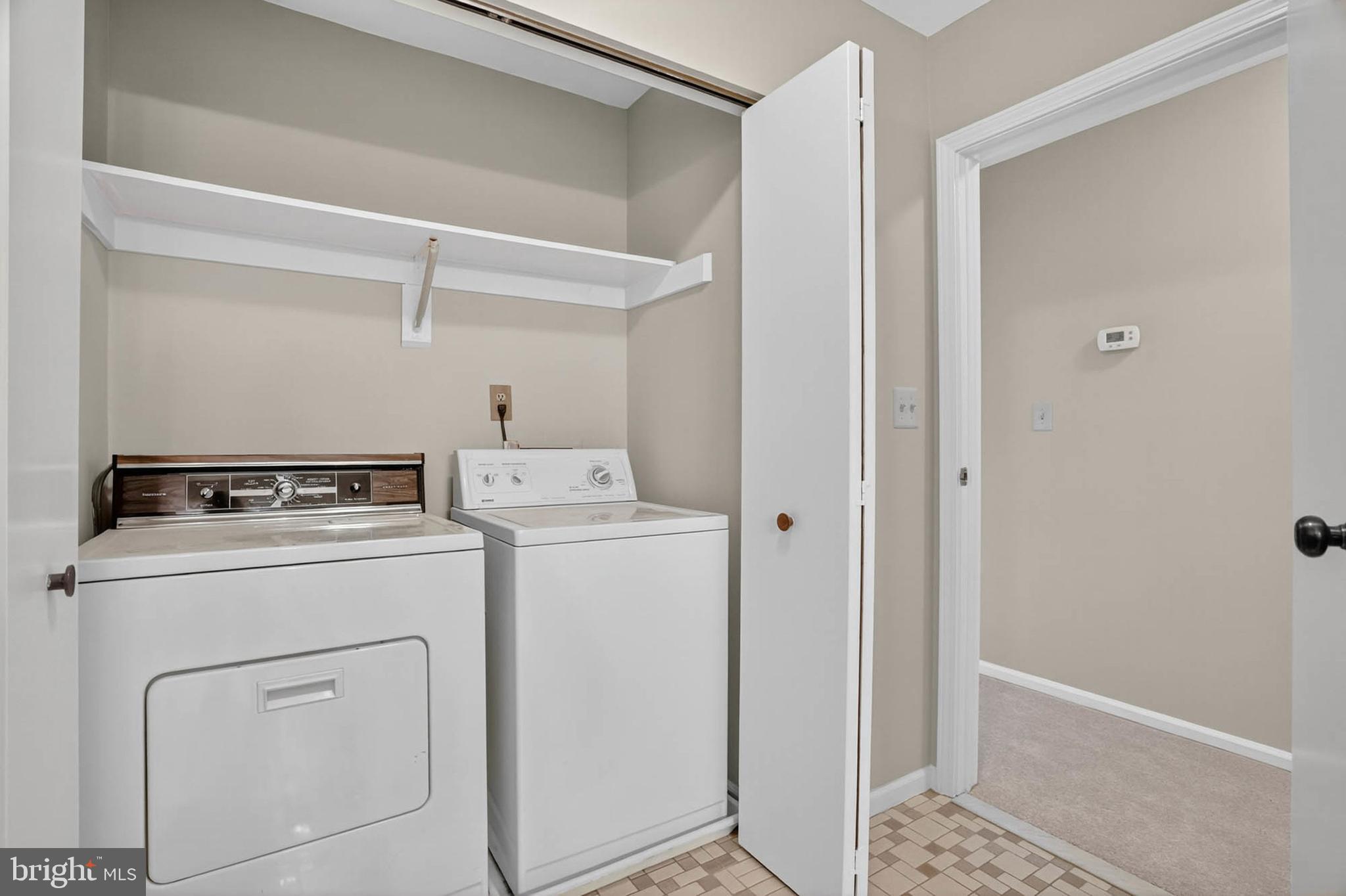 8203 Willow Street Laurel, MD 20707 - Photo 35 of 41 a utility room with dryer and washer