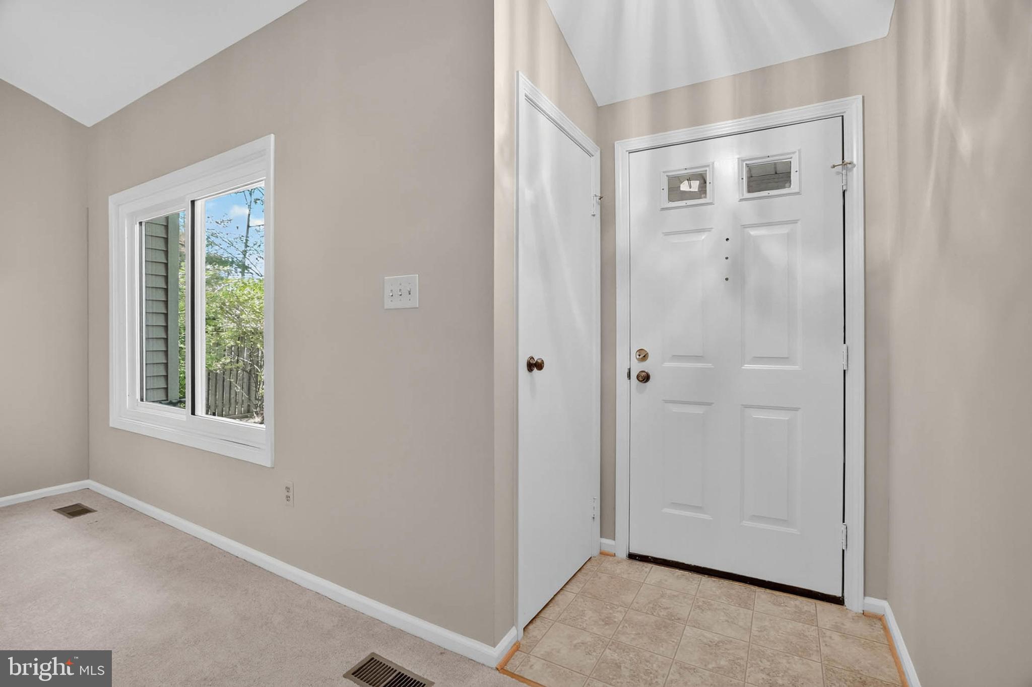 8203 Willow Street Laurel, MD 20707 - Photo 4 of 41 a view of an empty room with windows and closet