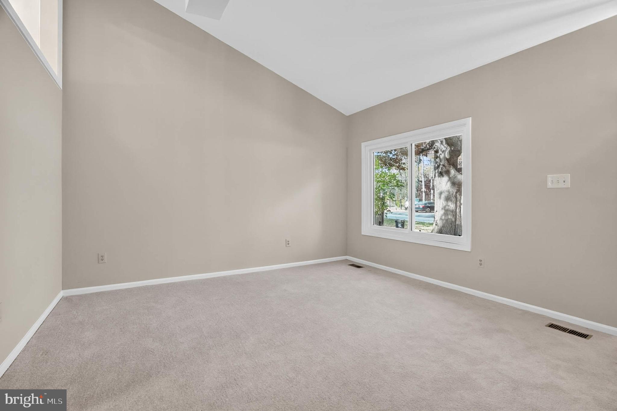 8203 Willow Street Laurel, MD 20707 - Photo 5 of 41 an empty room with windows and closet
