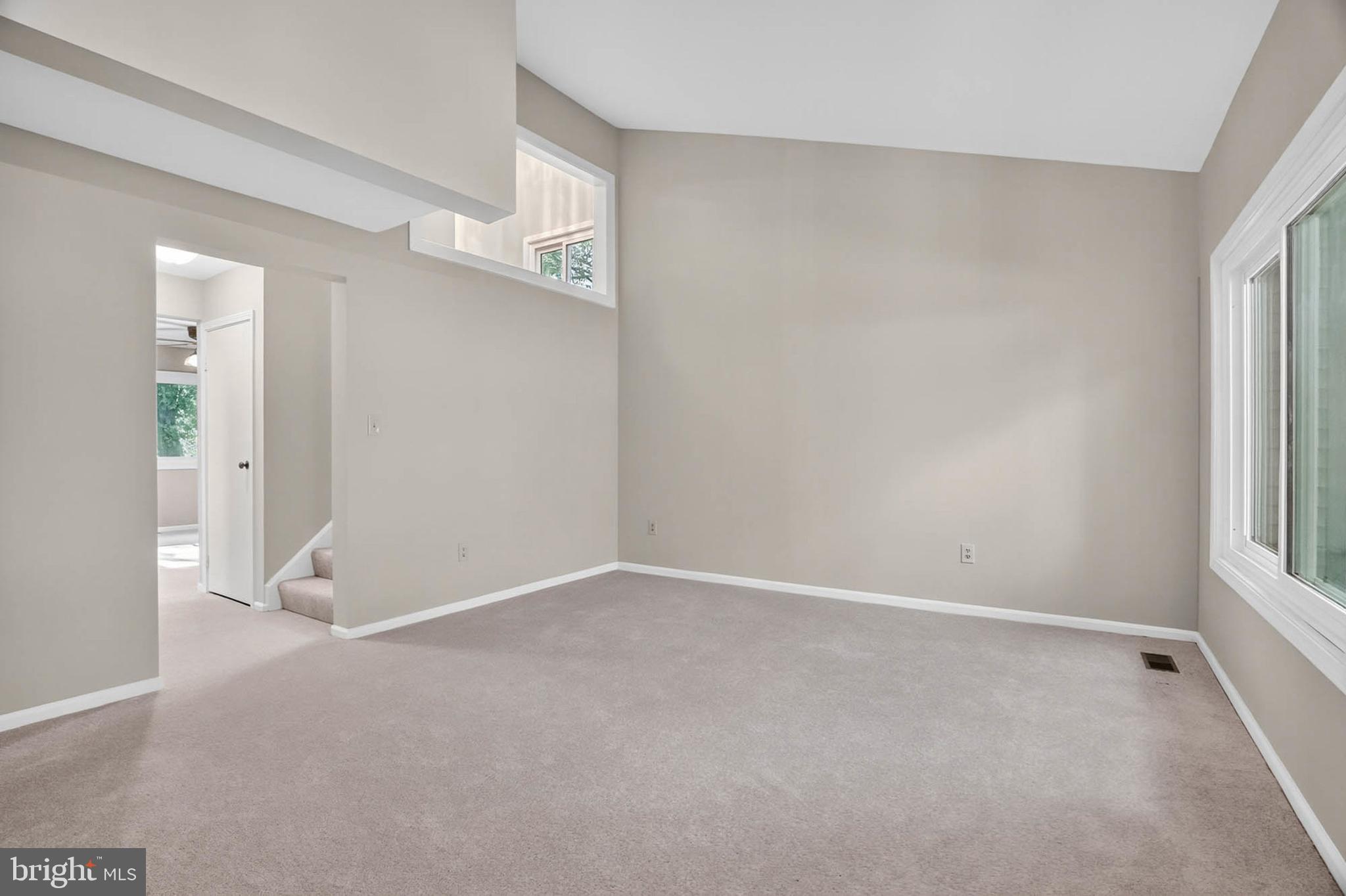 8203 Willow Street Laurel, MD 20707 - Photo 8 of 41 an empty room with windows and closet