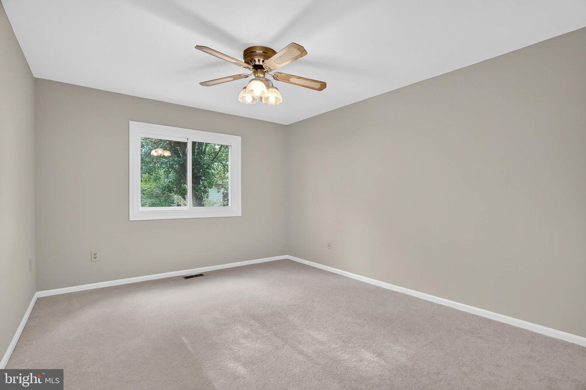 8203 Willow Street Laurel, MD 20707 - Photo 9 of 41 an empty room with windows and fan