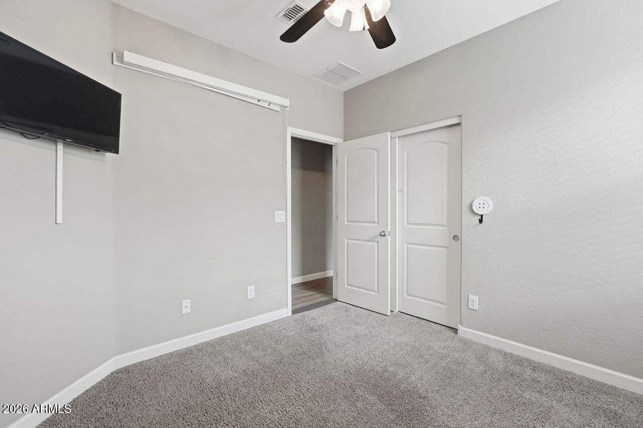 23602 West Ripple Road Buckeye, AZ 85326 - Photo 29 of 38 wooden floor in an empty room