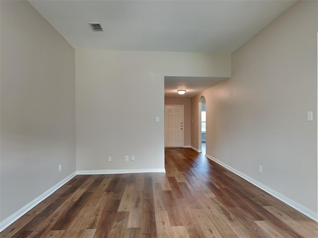 1334 Barrel Drive Dallas, TX 75253 - Photo 5 of 16 a view of empty room with wooden floor
