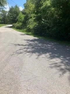 a view of a road with a yard