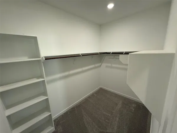 a view of an empty walk in closet