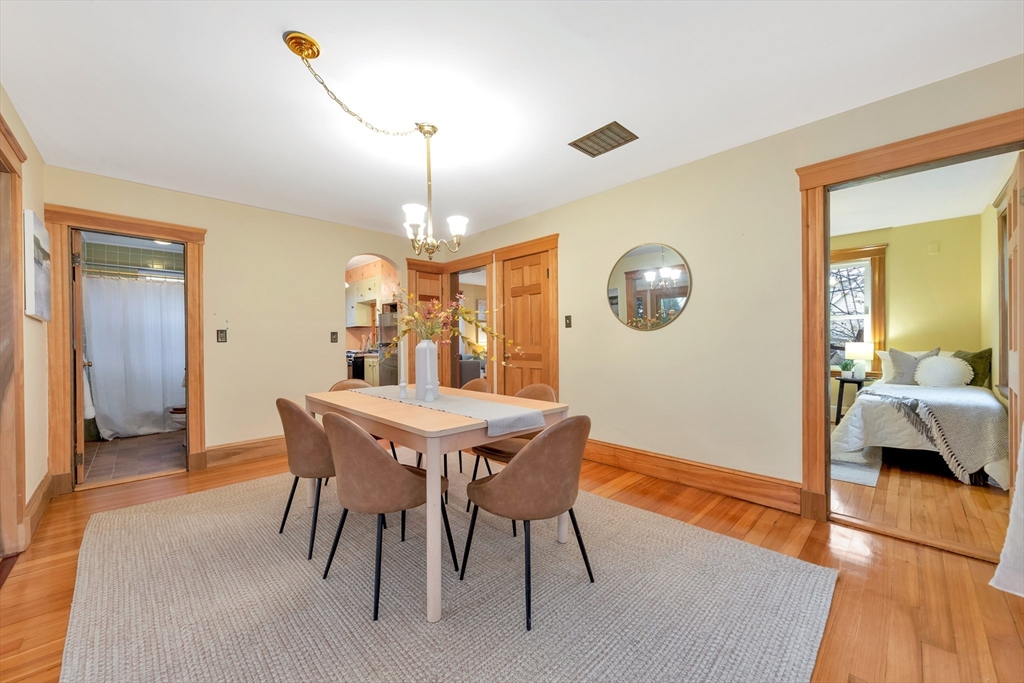 107 Hibbert Street Arlington, MA 02476 - Photo 13 of 40 a view of a dining room with furniture and wooden floor