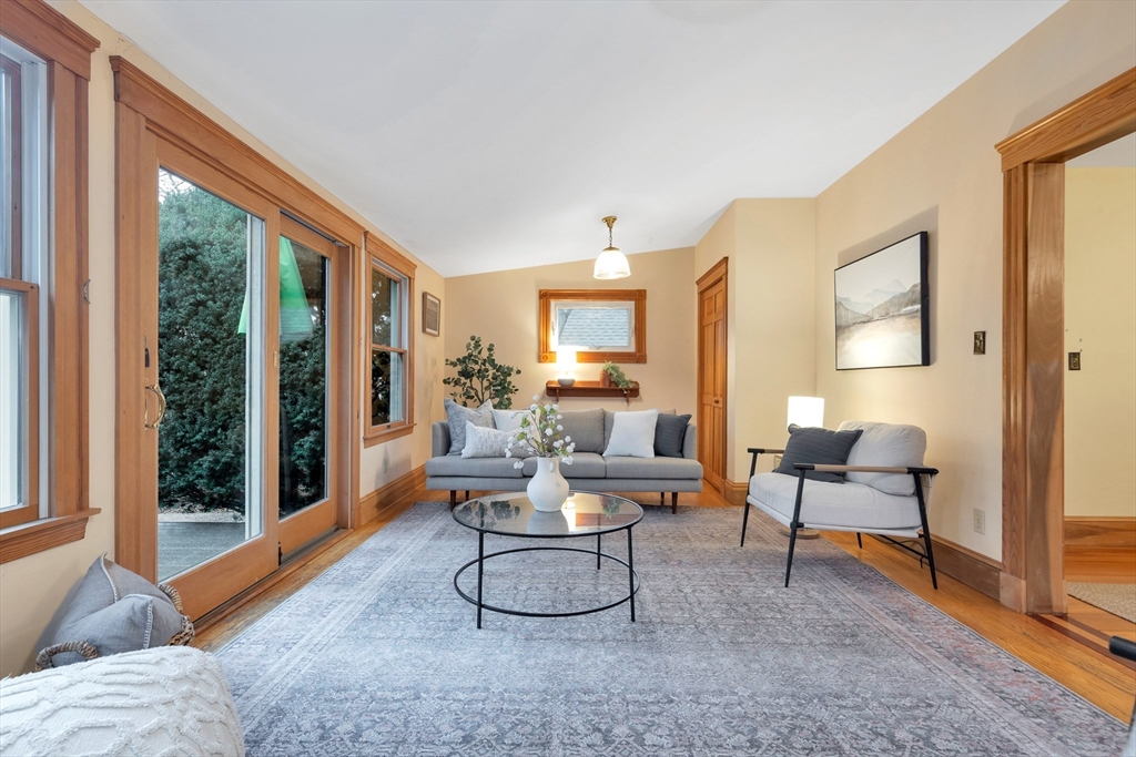 107 Hibbert Street Arlington, MA 02476 - Photo 20 of 40 a living room with furniture and a large window