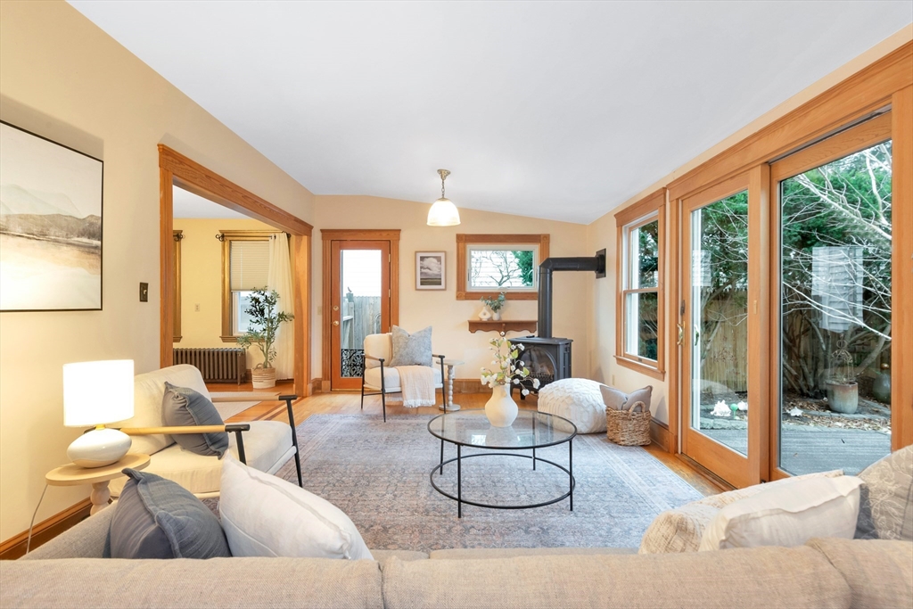 107 Hibbert Street Arlington, MA 02476 - Photo 23 of 40 a living room with furniture and a large window