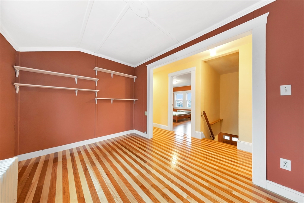 107 Hibbert Street Arlington, MA 02476 - Photo 27 of 40 a view of empty room with wooden floor