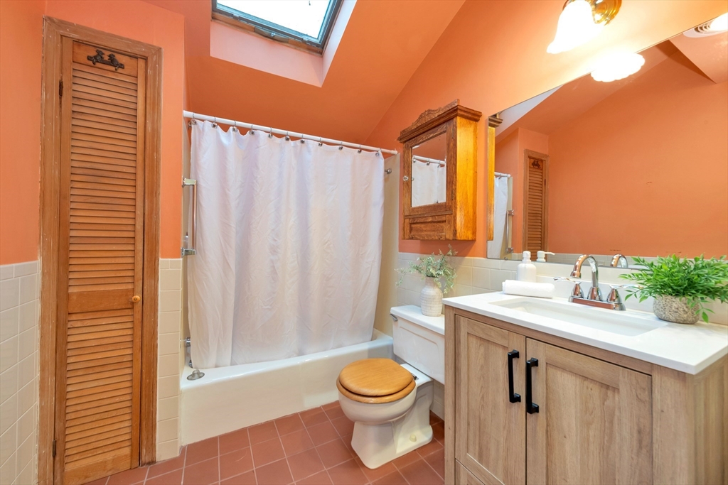 107 Hibbert Street Arlington, MA 02476 - Photo 30 of 40 a bathroom with a sink a toilet and shower