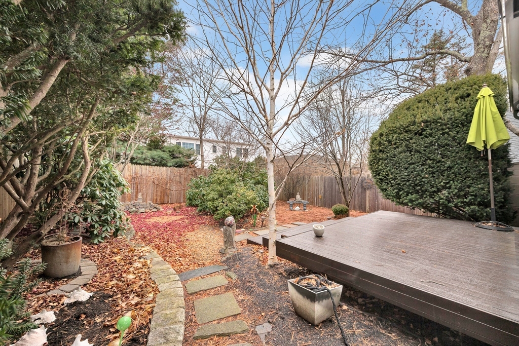 107 Hibbert Street Arlington, MA 02476 - Photo 35 of 40 a backyard of a house with outdoor seating