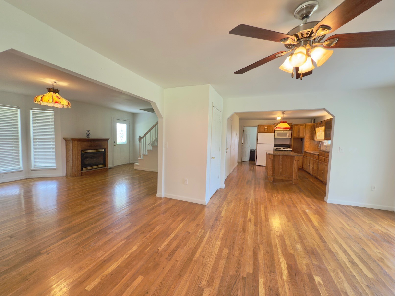 6907 Short Mountain Road Woodbury, TN 37190 - Photo 24 of 35 a view of a livingroom with furniture a ceiling fan and wooden floor