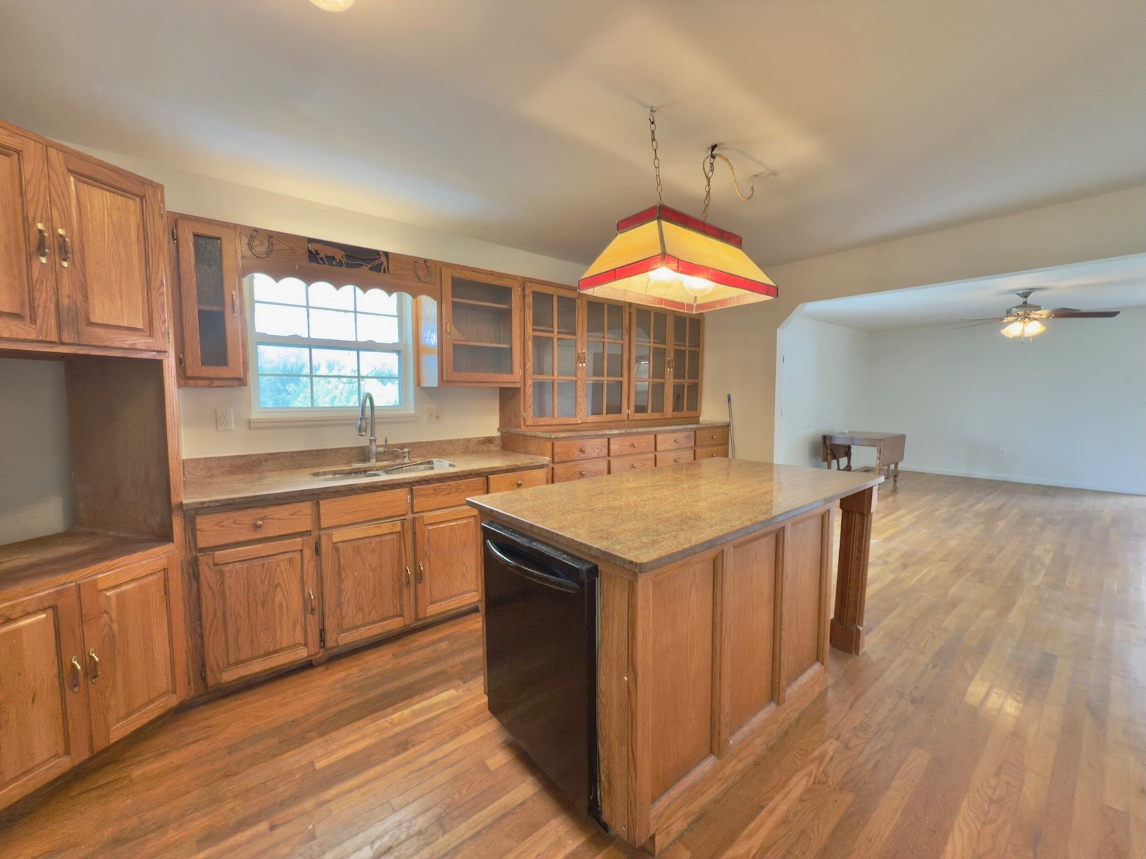 6907 Short Mountain Road Woodbury, TN 37190 - Photo 28 of 35 a kitchen with a sink cabinets and wooden floor
