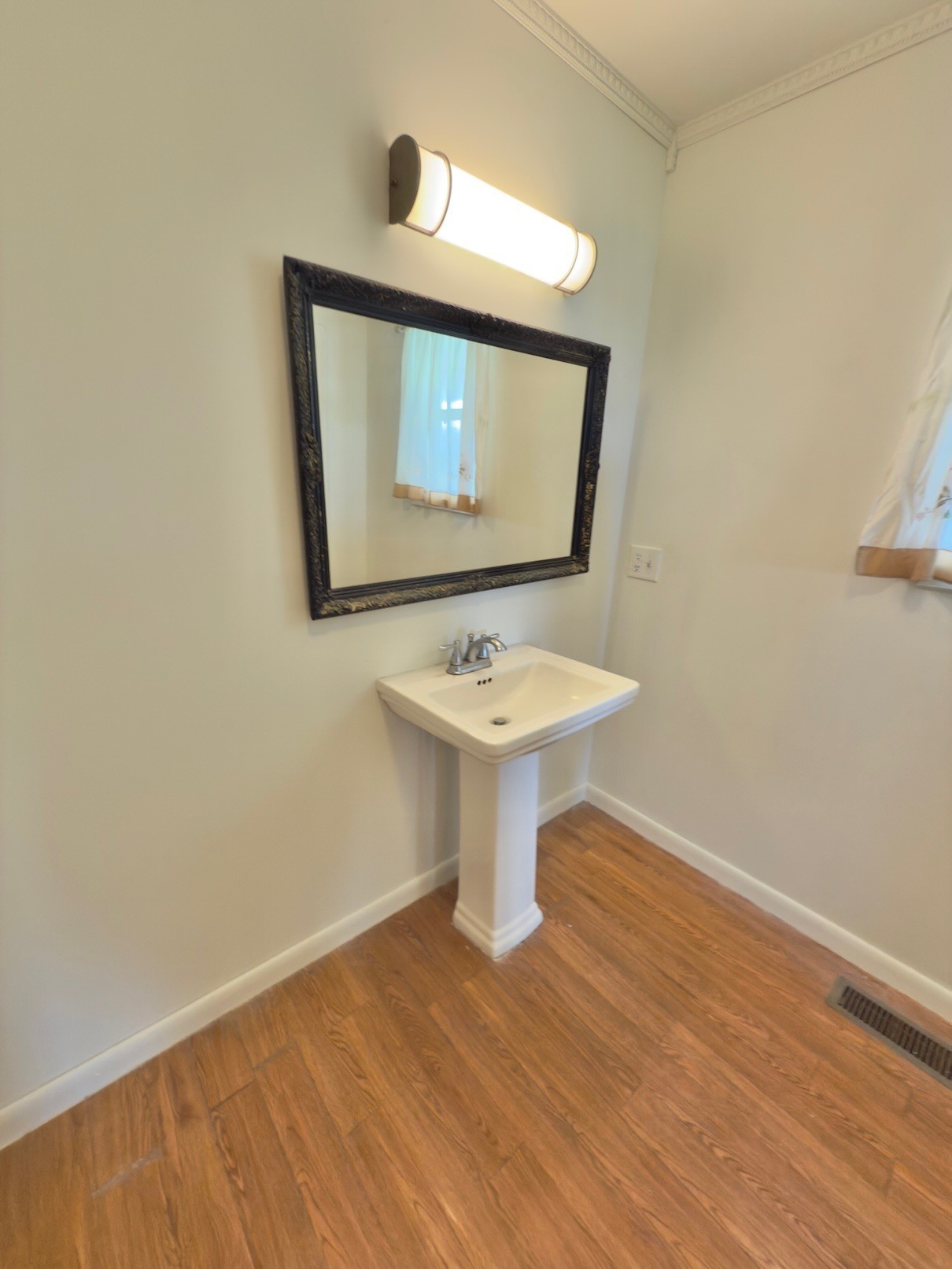 6907 Short Mountain Road Woodbury, TN 37190 - Photo 33 of 35 a bathroom with a toilet sink and mirror