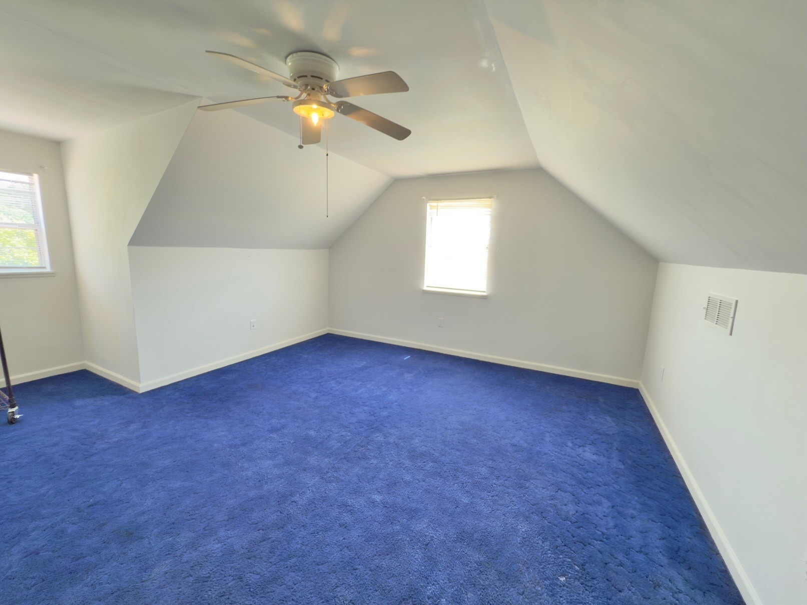 6907 Short Mountain Road Woodbury, TN 37190 - Photo 35 of 35 an empty room with a window and a ceiling fan