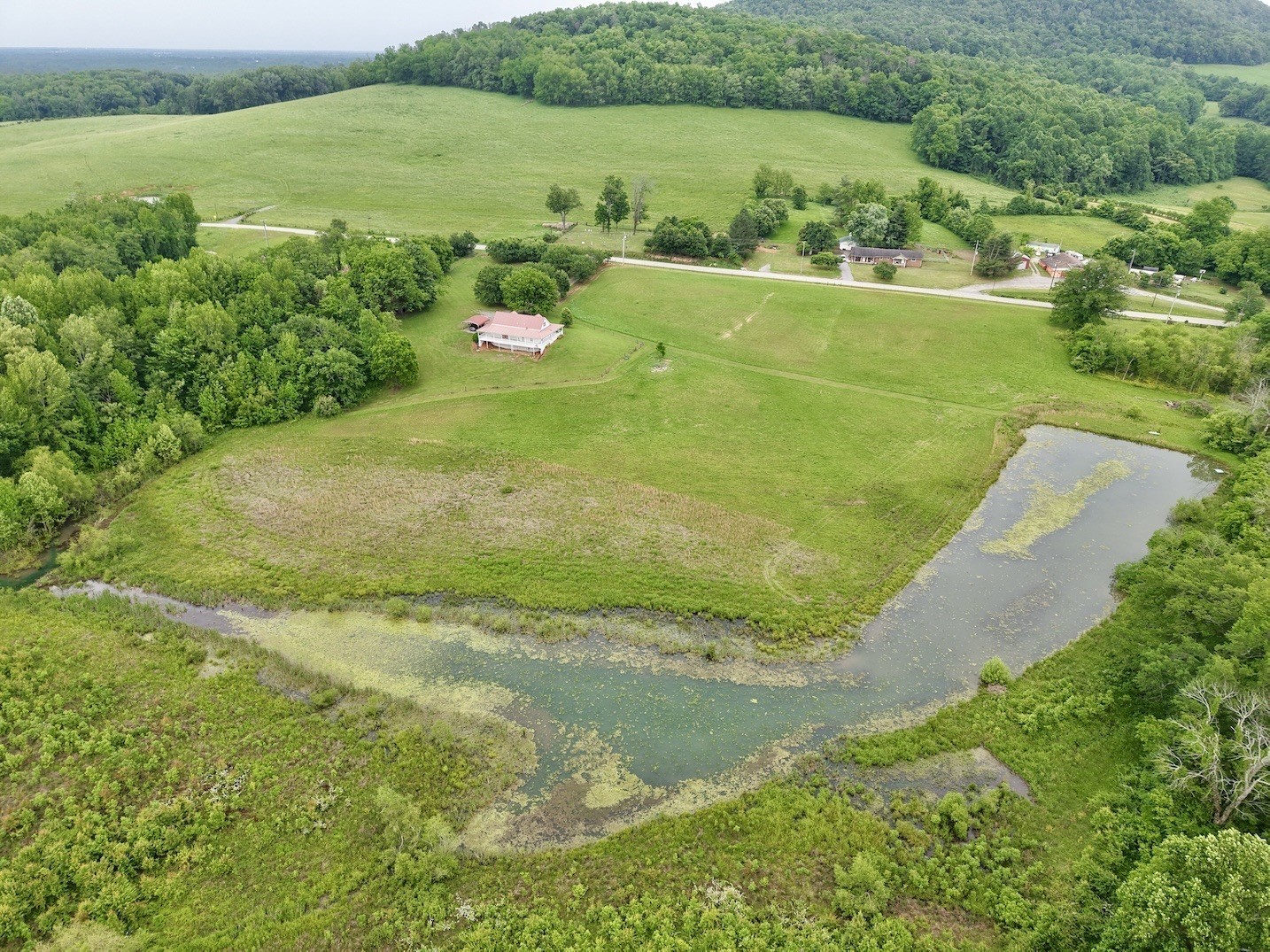 6907 Short Mountain Road Woodbury, TN 37190 - Photo 7 of 35 a view of a lake with a city