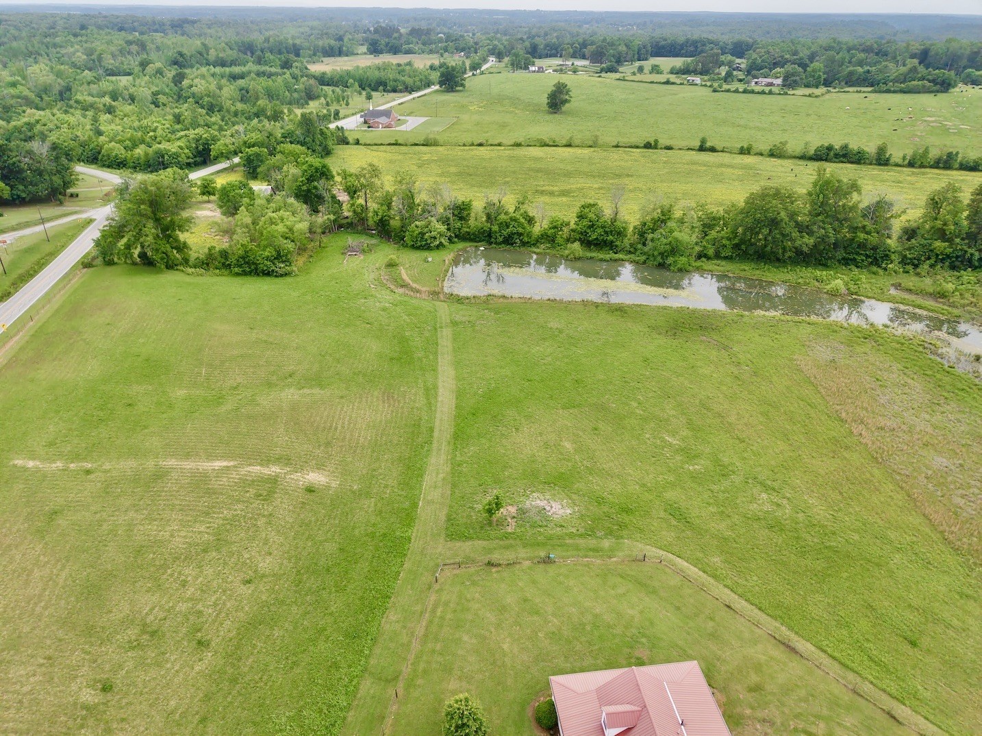 6907 Short Mountain Road Woodbury, TN 37190 - Photo 8 of 35 a view of a lake with a big yard