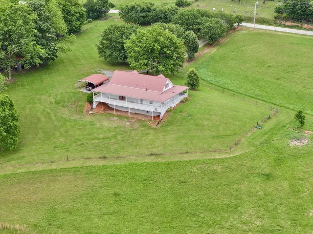 a view of a yard with a lake view