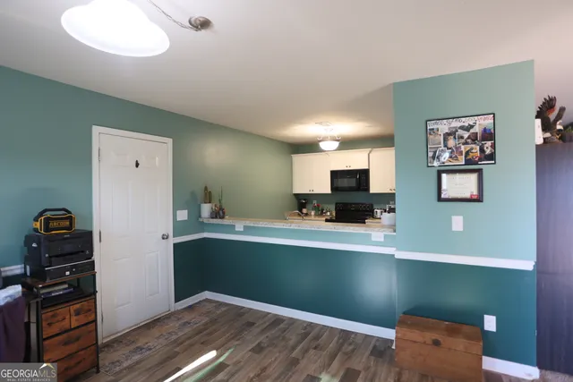 a room with cabinets and wooden floor