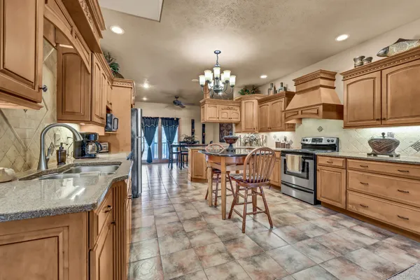 a kitchen with granite countertop a sink cabinets and counter space