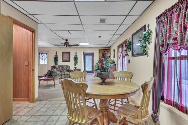 a view of porch with a bench and floor to ceiling window