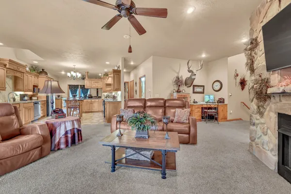 a living room with a fireplace a flat screen tv and a fireplace