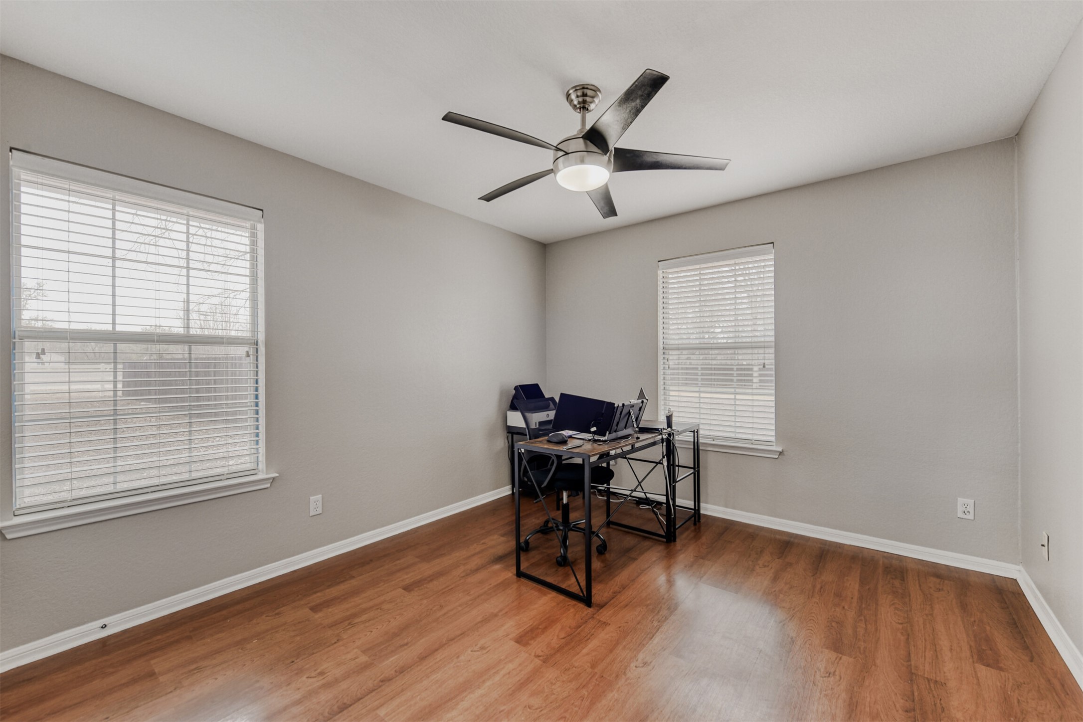 104 Spring Branch Bastrop, TX 78602 - Photo 12 of 32 a view of a workspace with furniture and a window
