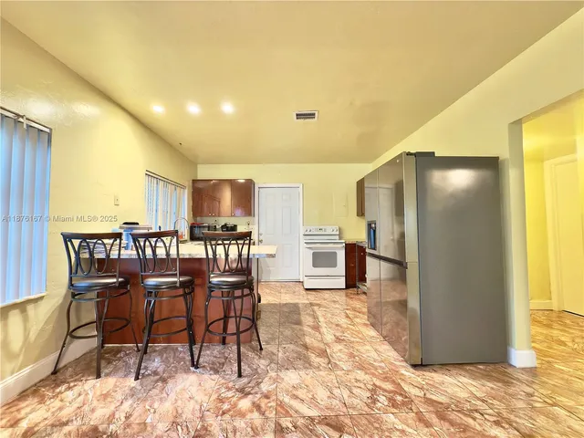 a view of a dining room with furniture