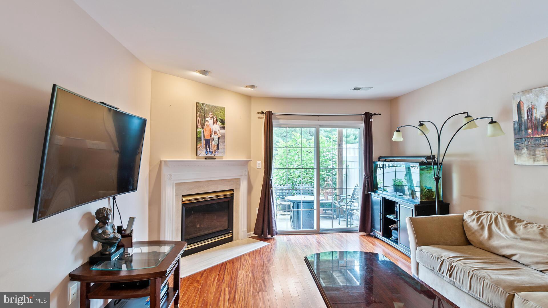 144 Coburn Road Pennington, NJ 08534 - Photo 6 of 32 Gas fireplace and slider to large, fenced patio