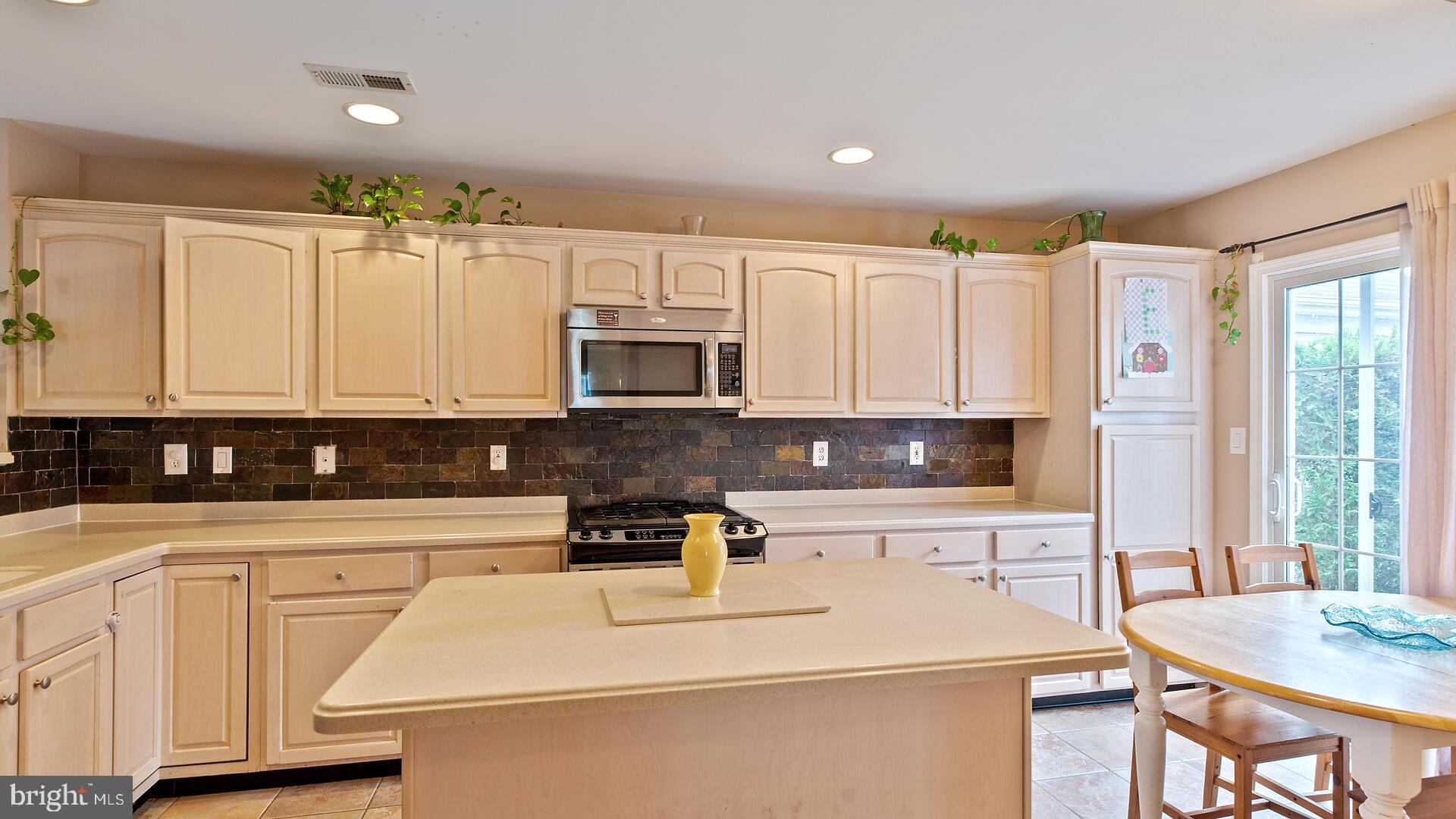 144 Coburn Road Pennington, NJ 08534 - Photo 10 of 32 Kitchen island with breakfast bar