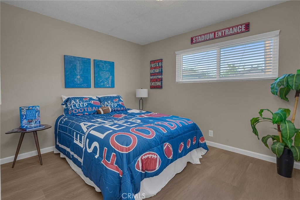 217 East 221st Street Carson, CA 90745 - Photo 26 of 73 a bedroom with a bed and a window
