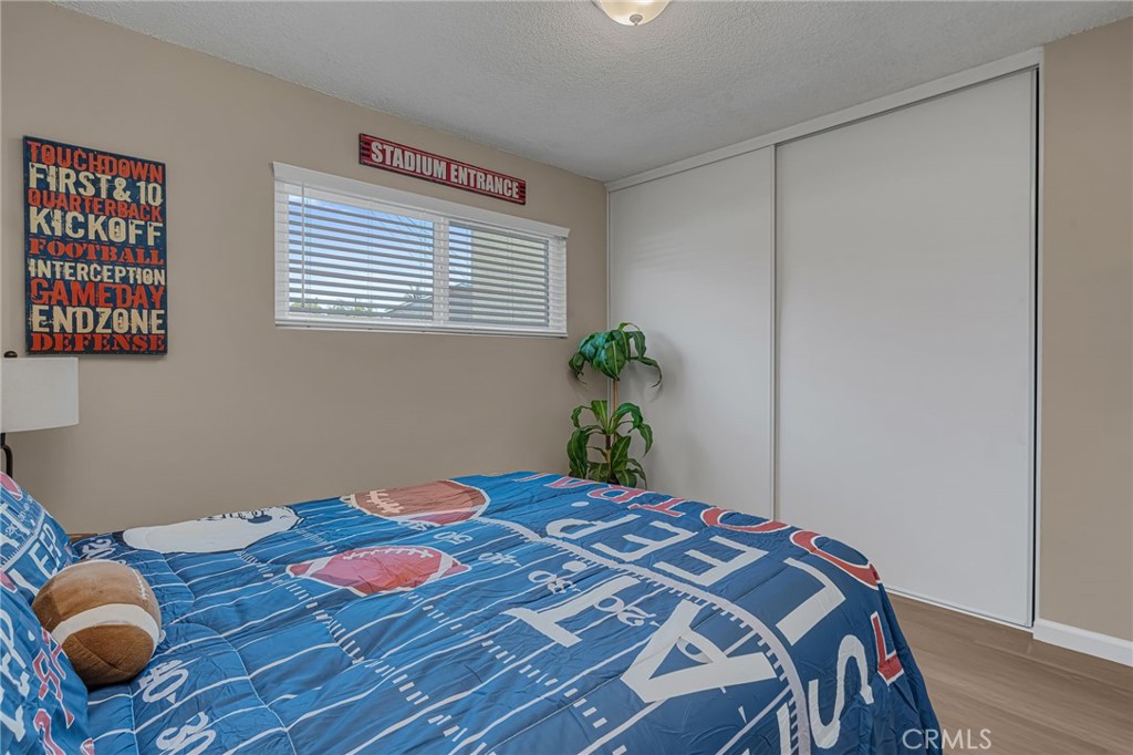 217 East 221st Street Carson, CA 90745 - Photo 28 of 73 a bedroom with a bed and a window
