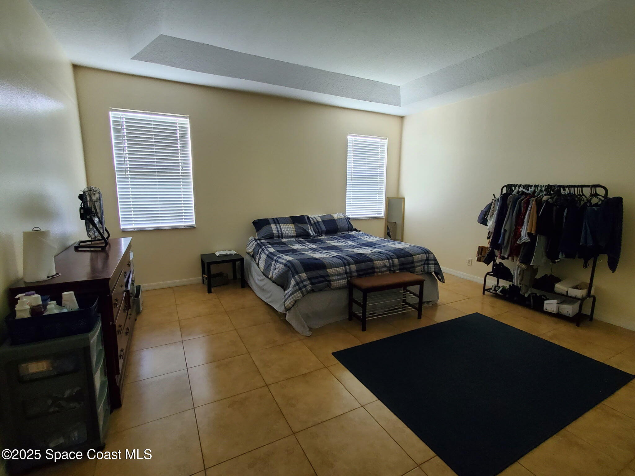 561 Lambert Street Southwest Palm Bay, FL 32908 - Photo 6 of 10 a bedroom with furniture and a window