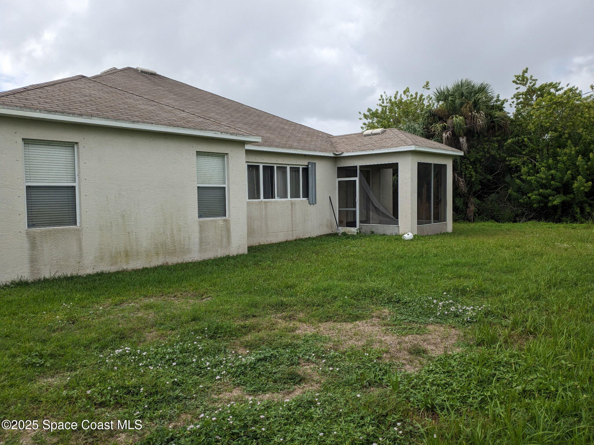 561 Lambert Street Southwest Palm Bay, FL 32908 - Photo 10 of 10 a view of a house with a garden