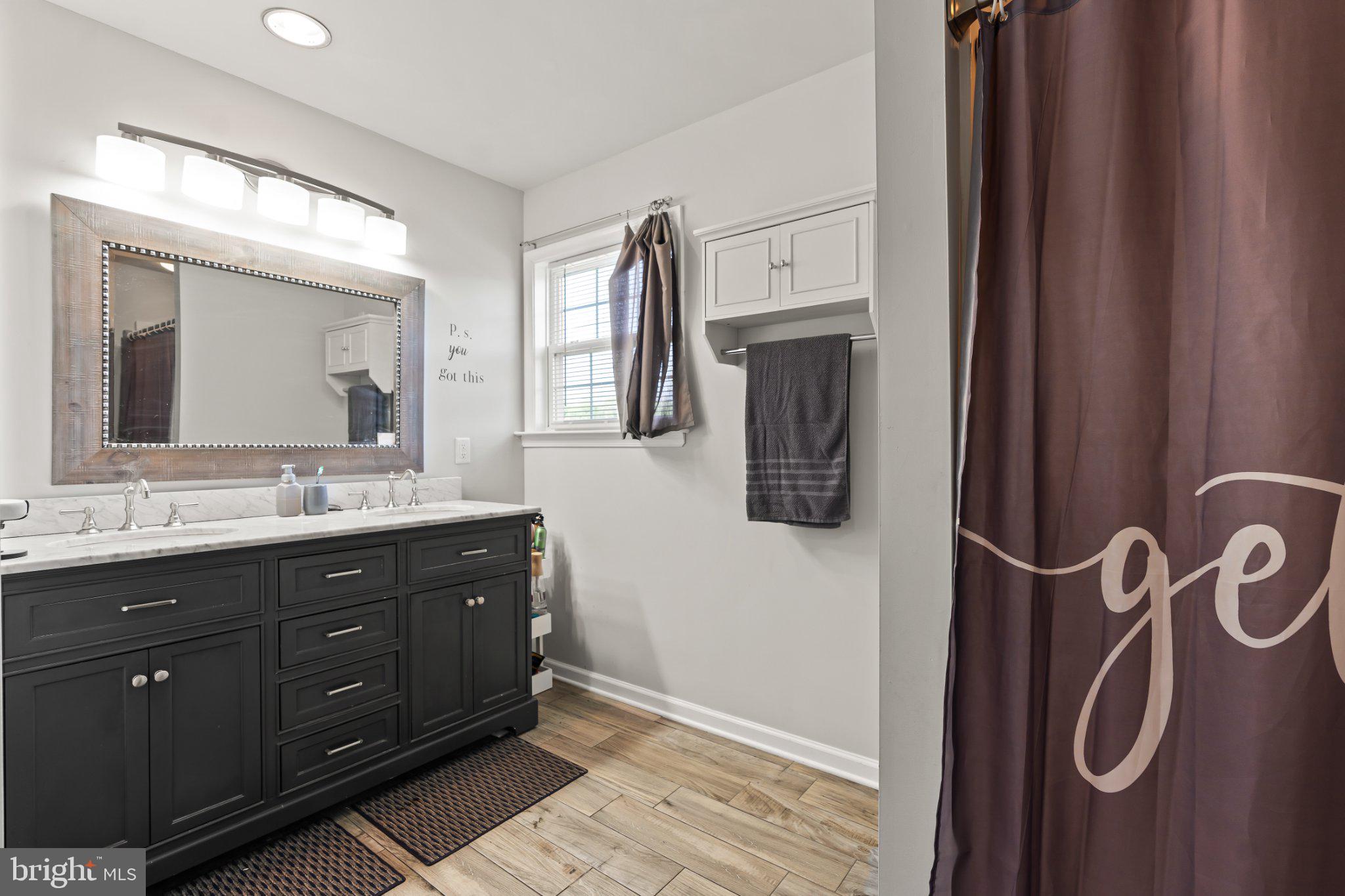 128 Sentry Ridge Smithsburg, MD 21783 - Photo 22 of 41 a spacious bathroom with a double vanity sink and a mirror