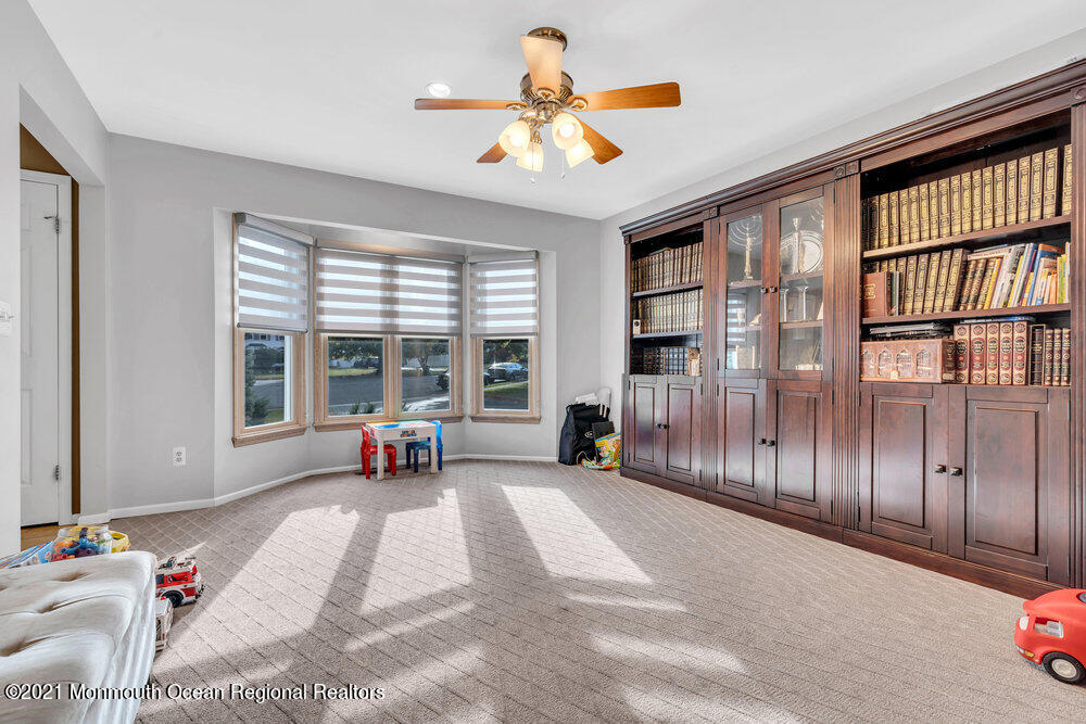 67 Chelsea Road Jackson, NJ 08527 - Photo 13 of 53 a bedroom with a bed and a large window