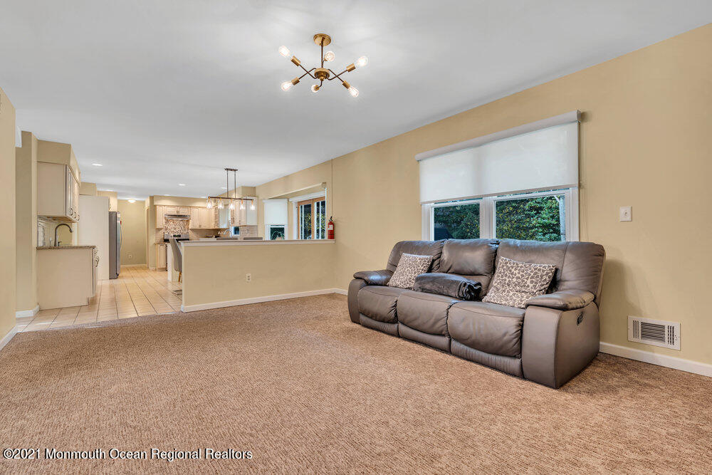 67 Chelsea Road Jackson, NJ 08527 - Photo 17 of 53 a living room with furniture and a view of kitchen