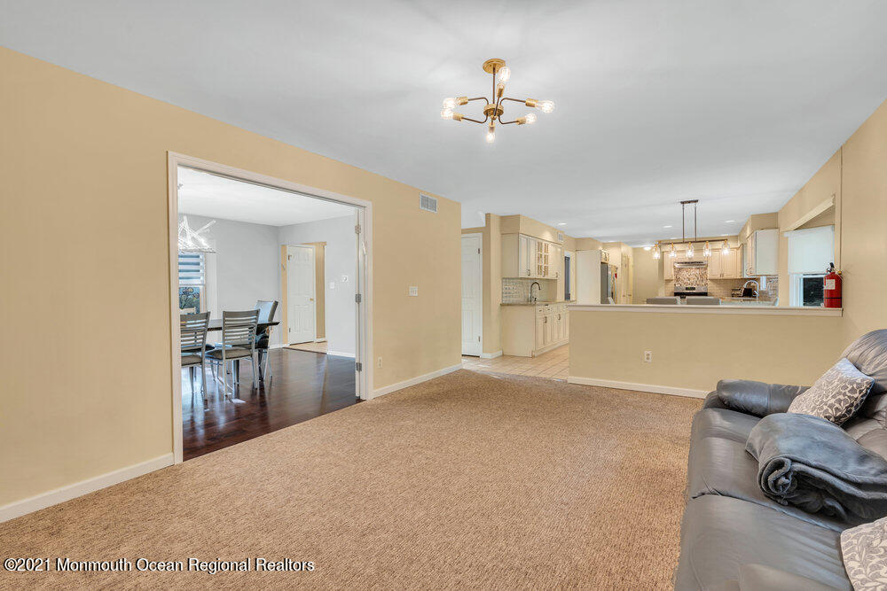 67 Chelsea Road Jackson, NJ 08527 - Photo 18 of 53 a view of a livingroom with furniture and a chandelier