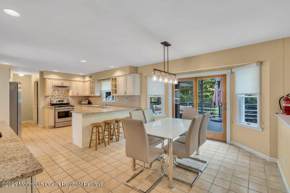 67 Chelsea Road Jackson, NJ 08527 - Photo 21 of 53 a outdoor space with a large window and dining table