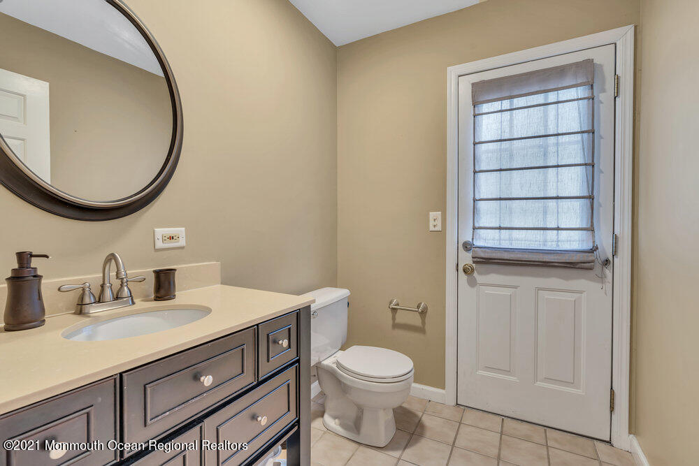 67 Chelsea Road Jackson, NJ 08527 - Photo 28 of 53 a bathroom with a toilet a sink a vanity and mirror