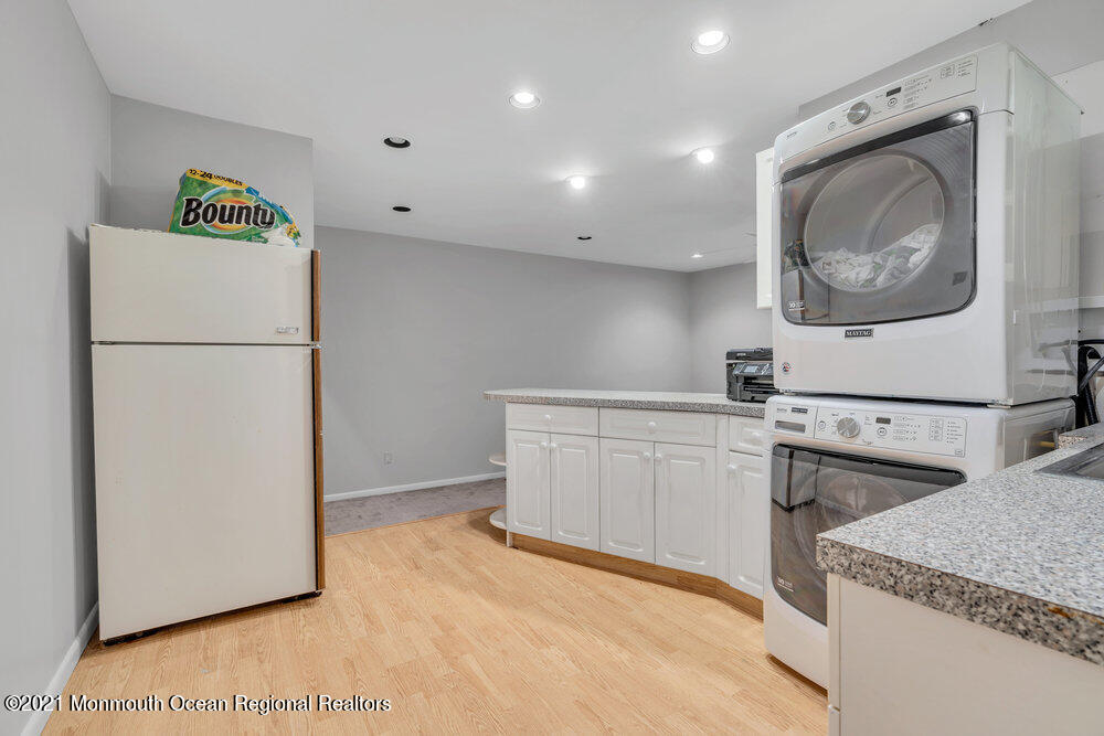 67 Chelsea Road Jackson, NJ 08527 - Photo 29 of 53 a kitchen with a refrigerator sink stove and cabinets