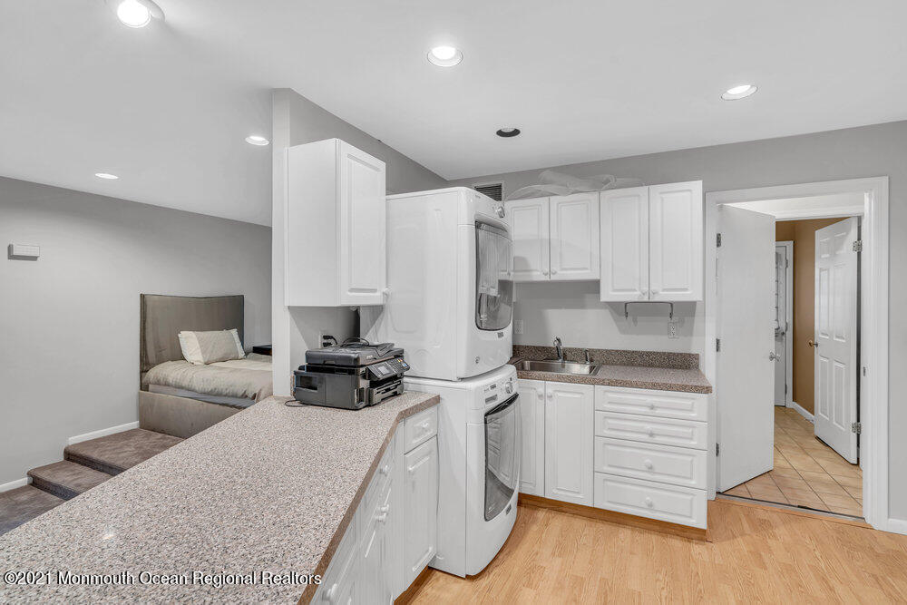 67 Chelsea Road Jackson, NJ 08527 - Photo 30 of 53 a kitchen with granite countertop a sink cabinets and wooden floor